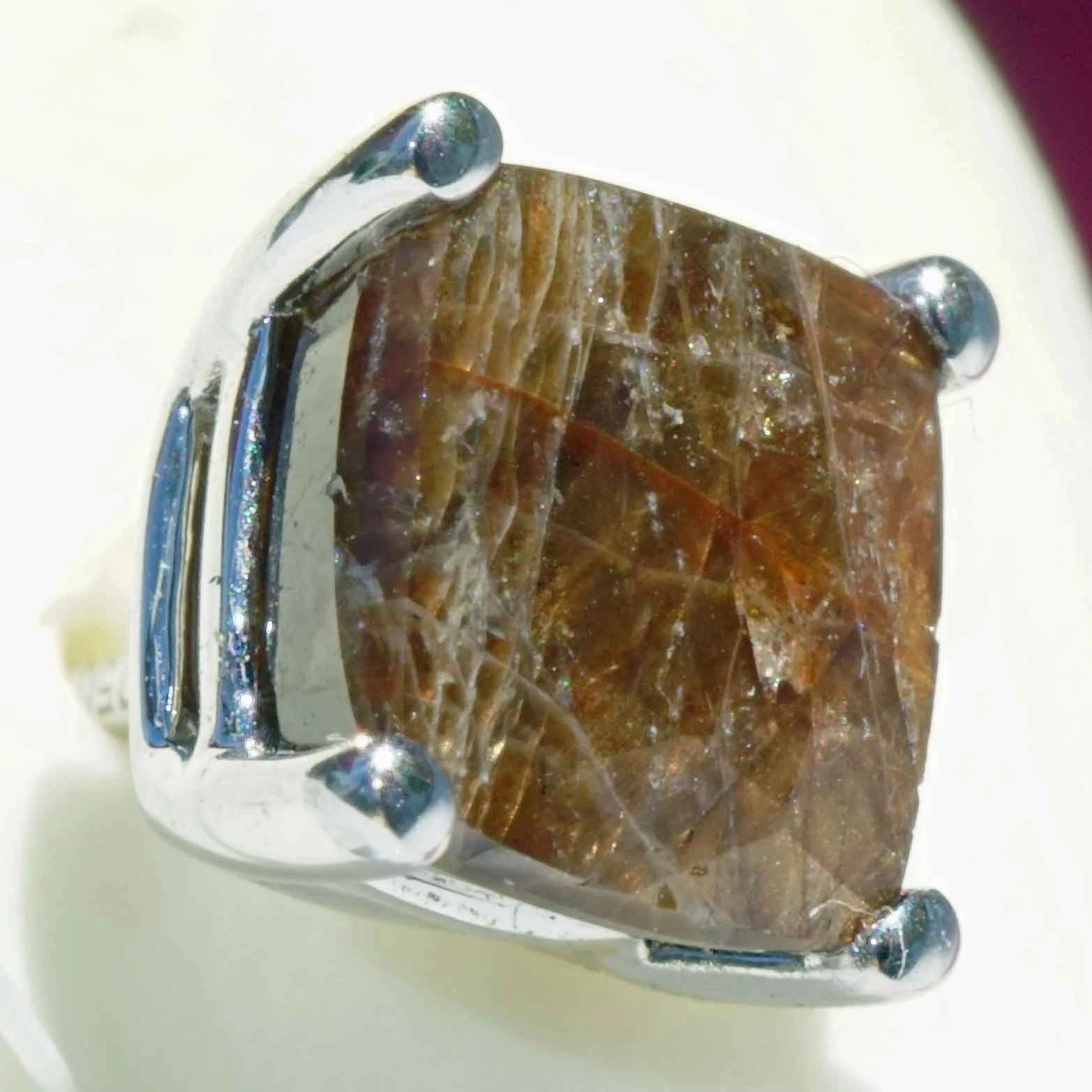 Single ear stud with a rare gold colored sapphire