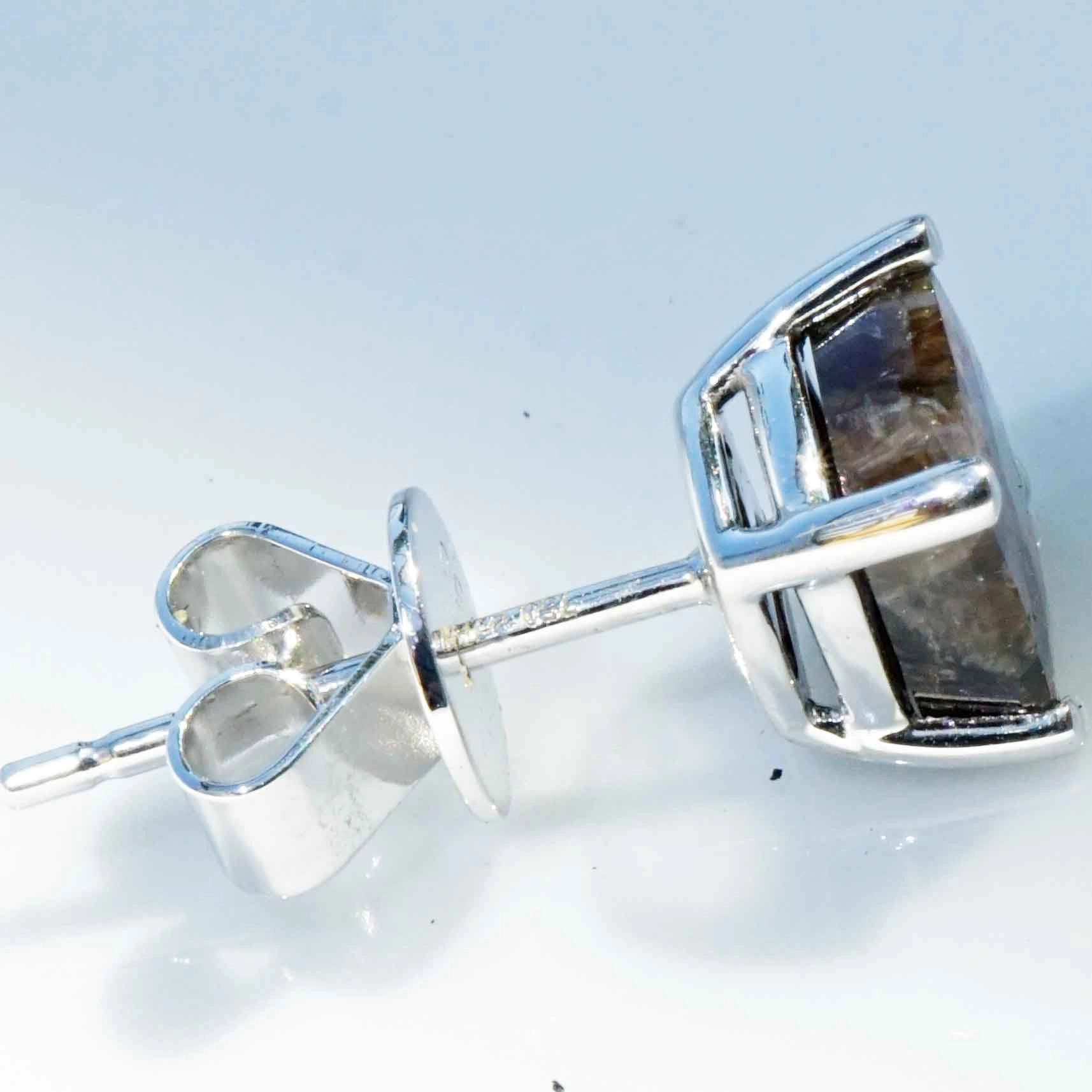 Single ear stud with a rare gold colored sapphire