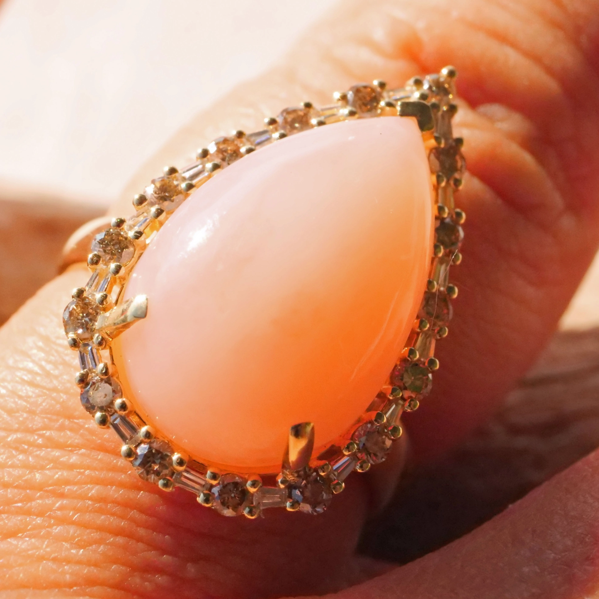 Andean Opal Cabochon effectively wreathed with Diamond Baguettes and Brilliants 18 kt Yellow Gold