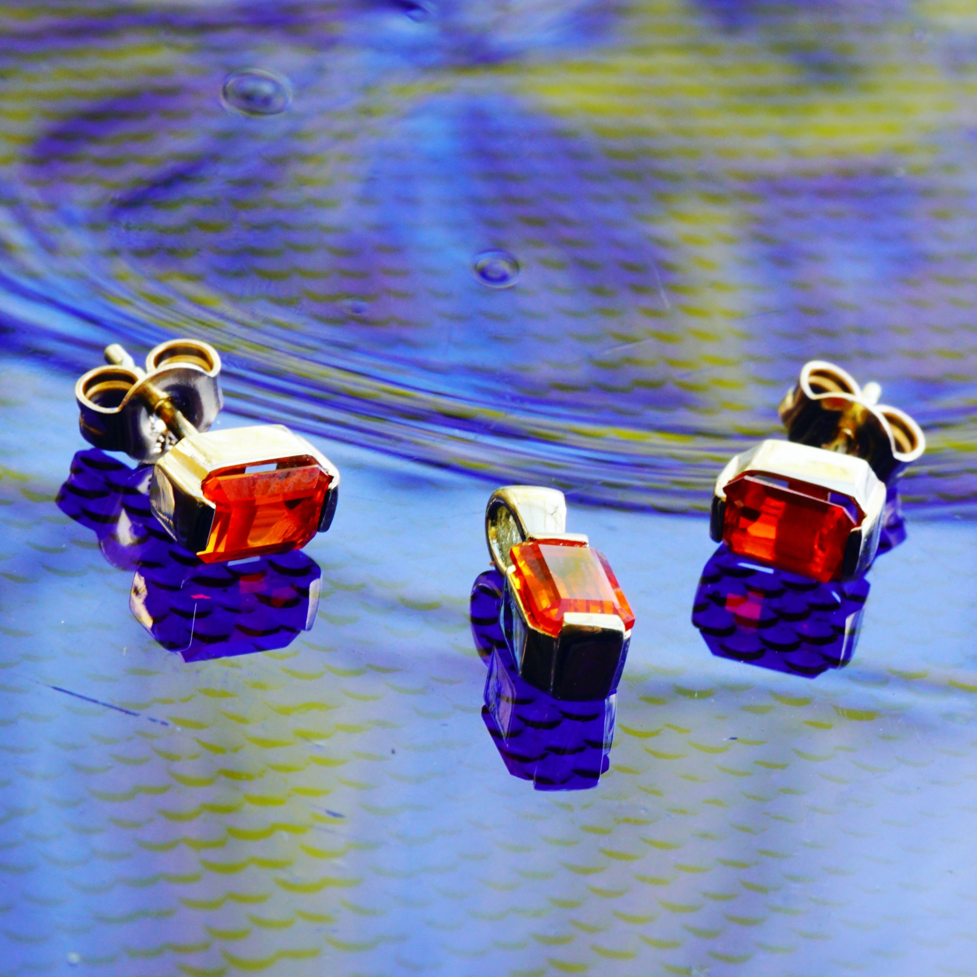 Feueropal Ohrstecker in 585er Gelbgold
