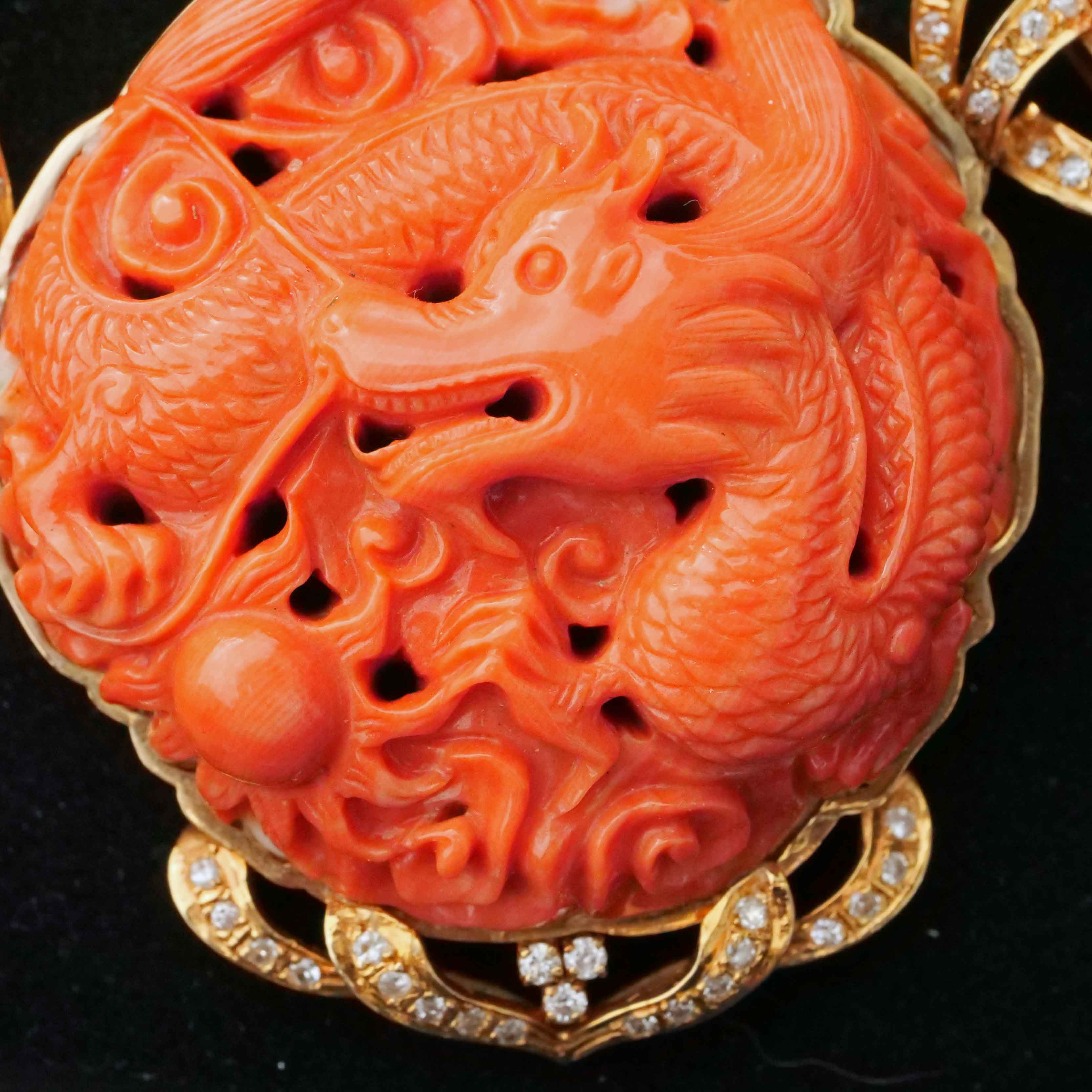Coral Brilliant Necklace around 1980 with carved Dragon Motifs and four-row Coral Ball Chain
