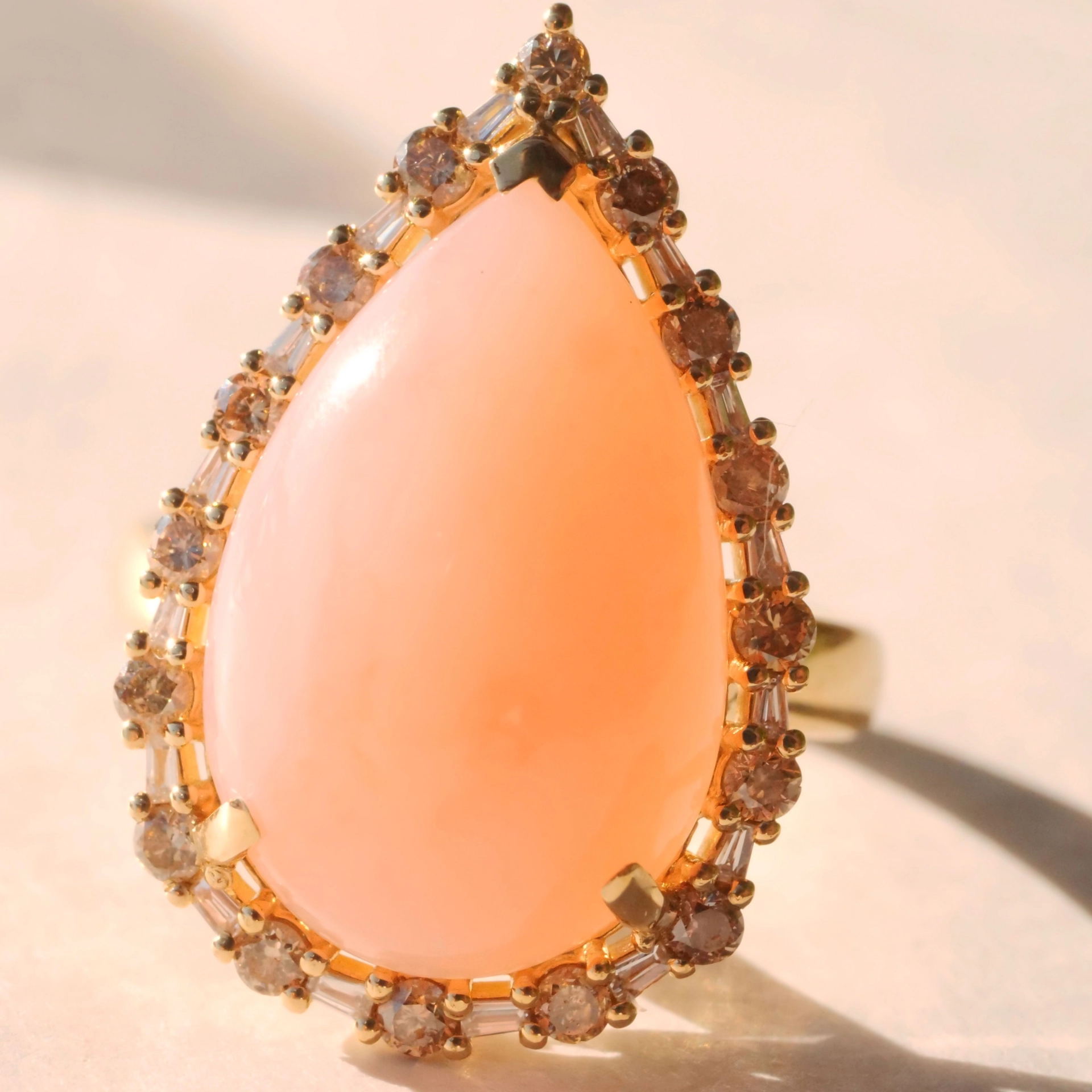 Andean Opal Cabochon effectively wreathed with Diamond Baguettes and Brilliants 18 kt Yellow Gold