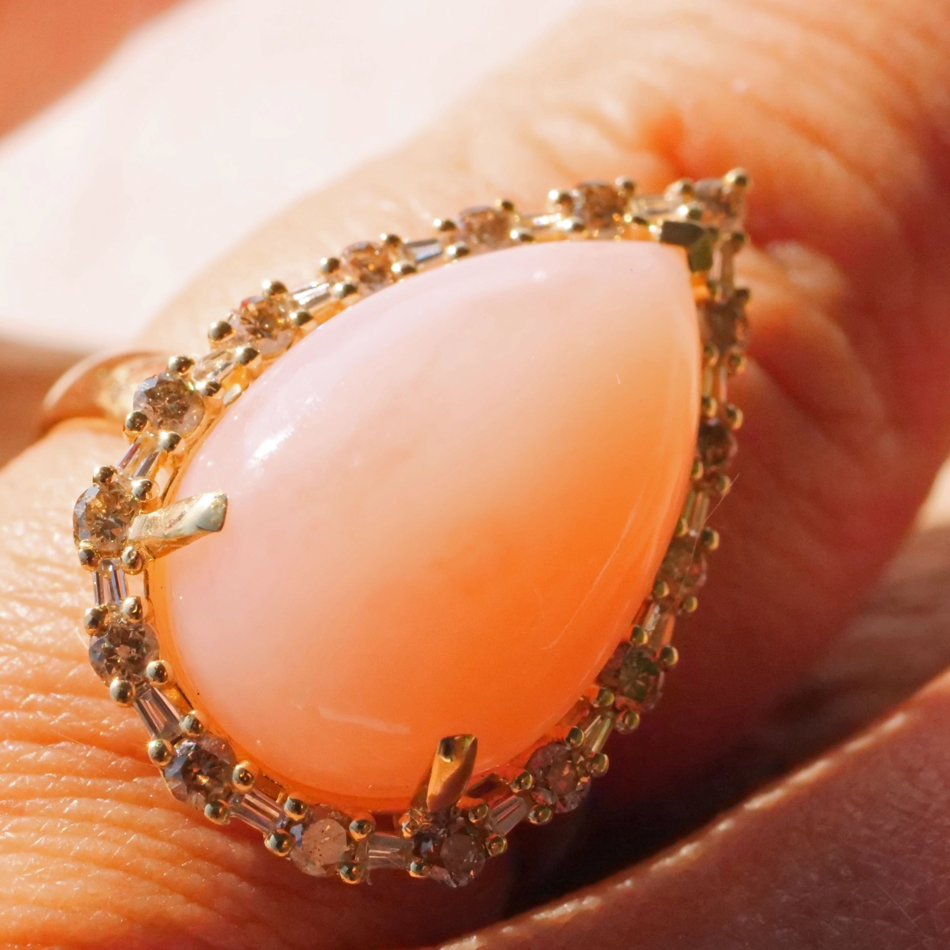 Andean Opal Cabochon effectively wreathed with Diamond Baguettes and Brilliants 18 kt Yellow Gold