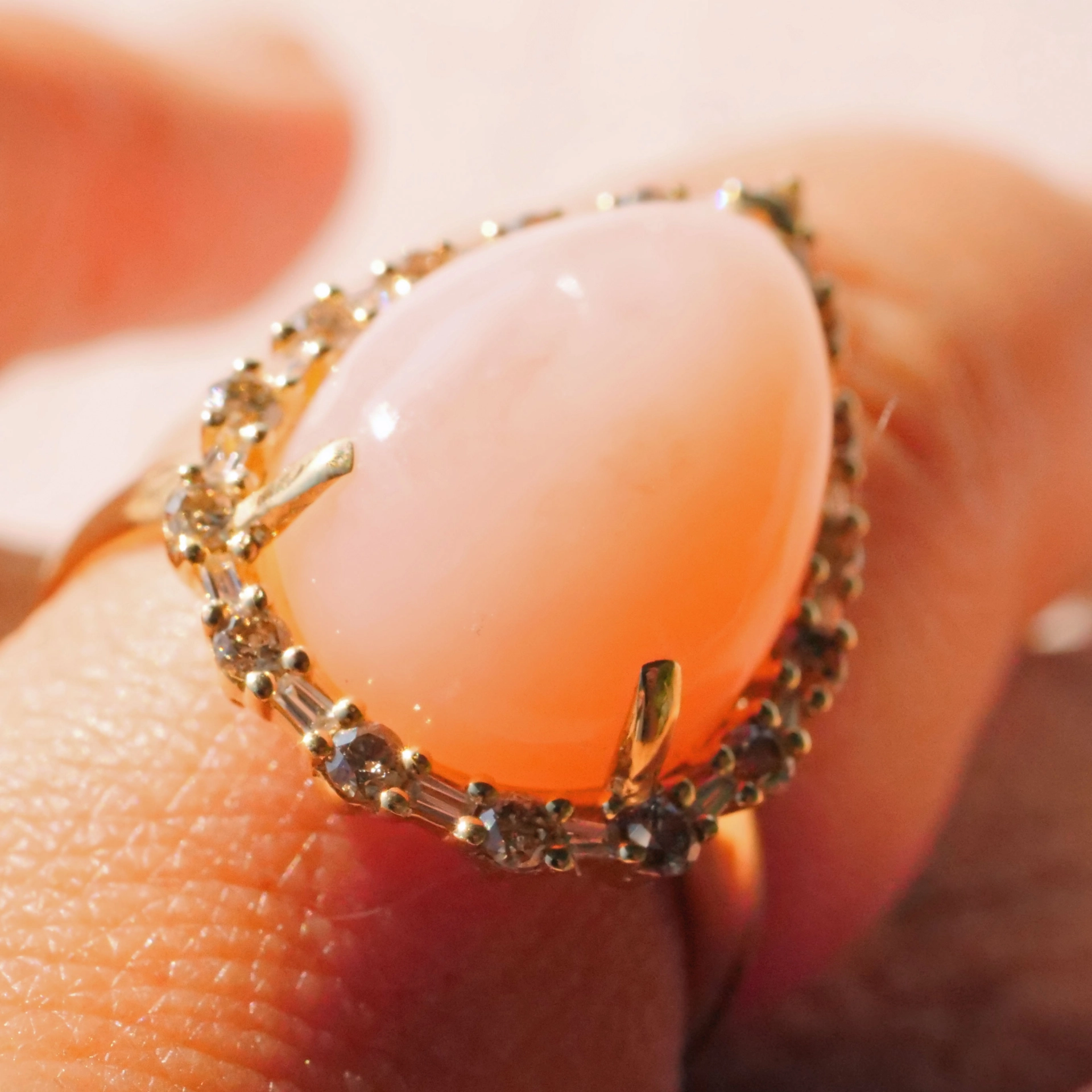 Andean Opal Cabochon effectively wreathed with Diamond Baguettes and Brilliants 18 kt Yellow Gold