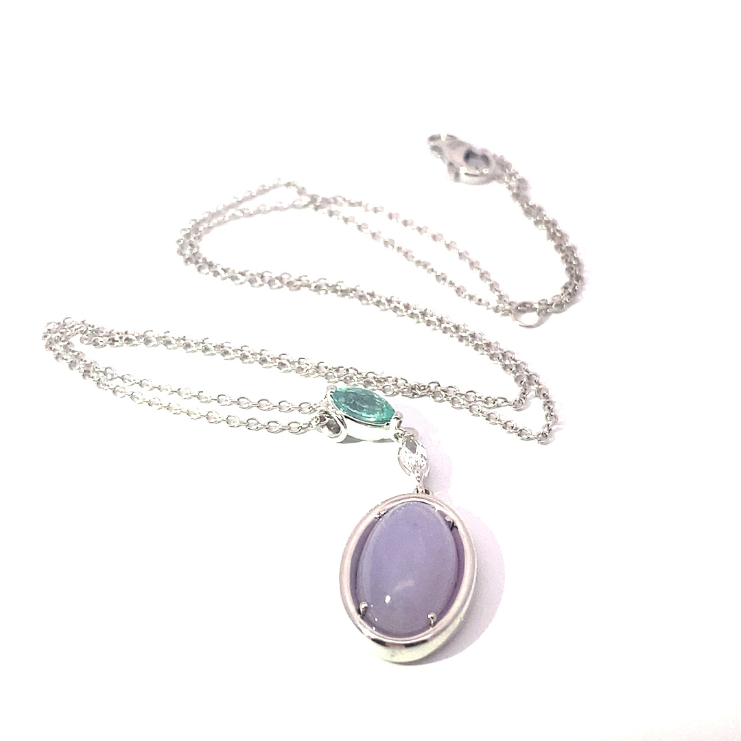 great paraiba turmalin of 1.18 ct, AAA brilliant. swimmingpool blue-green color, original from brasil, 18 kt whitegold, combinated with a princess cut diamond 0.36 ct