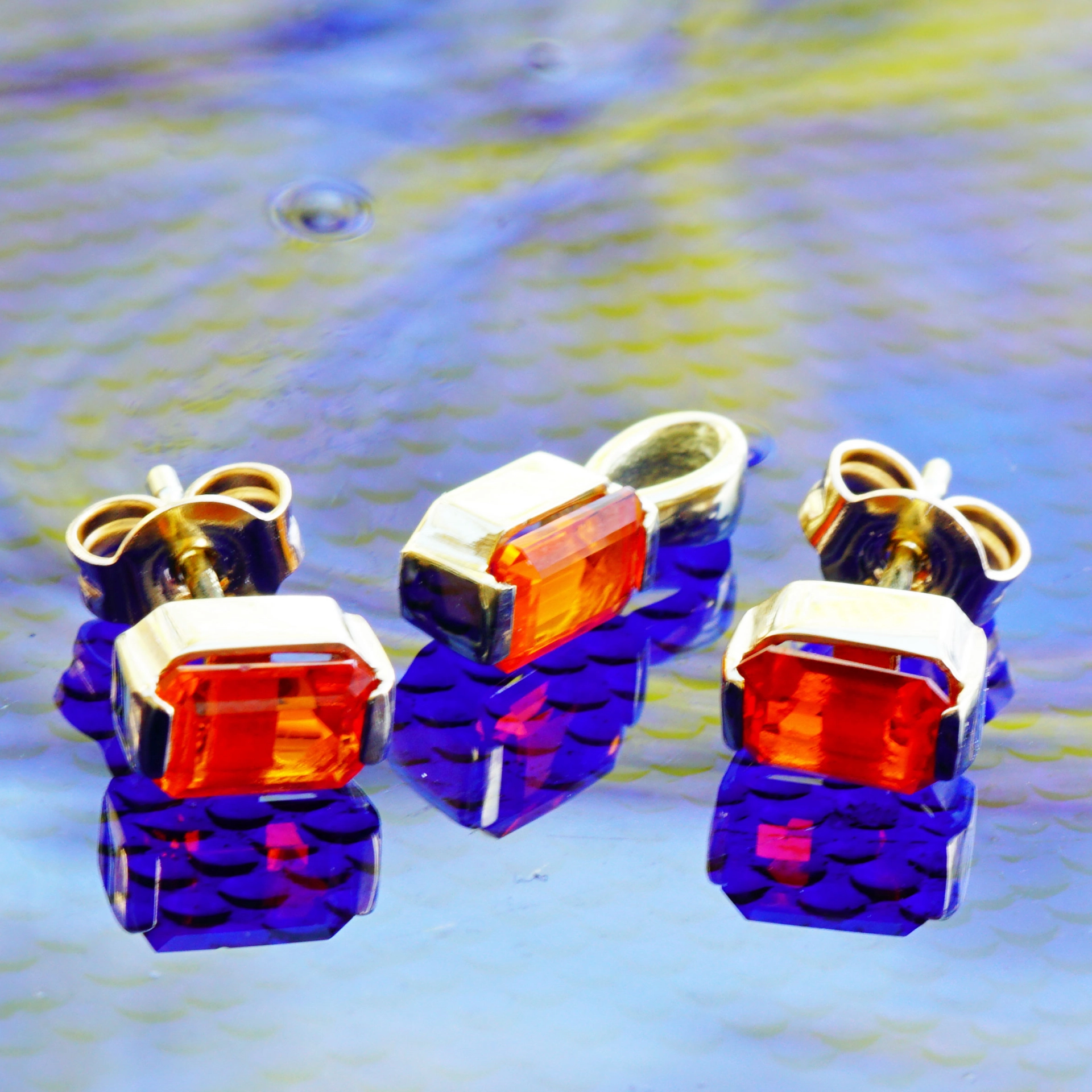 Feueropal Ohrstecker in 585er Gelbgold