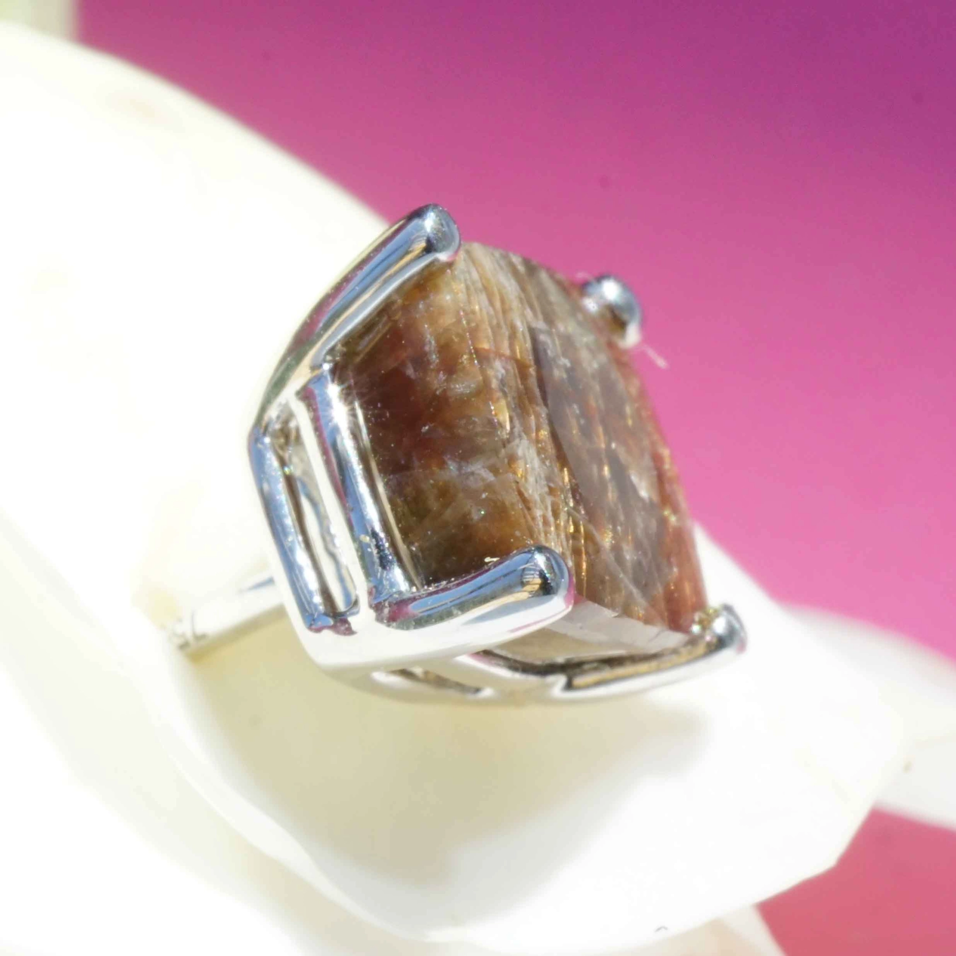 Single ear stud with a rare gold colored sapphire