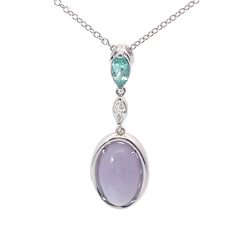 great paraiba turmalin of 1.18 ct, AAA brilliant. swimmingpool blue-green color, original from brasil, 18 kt whitegold, combinated with a princess cut diamond 0.36 ct