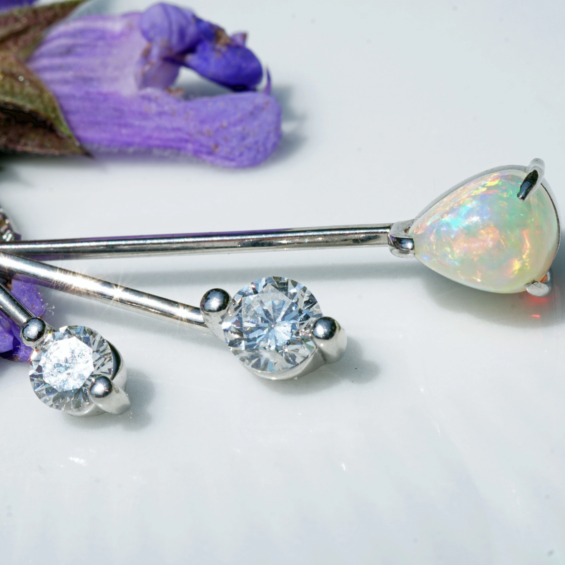 like a mobile....very pretty opal pendant with diamonds platinium setting