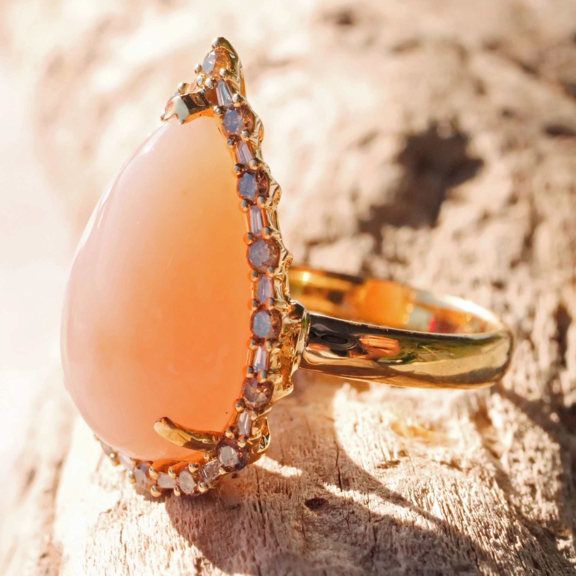 Andean Opal Cabochon effectively wreathed with Diamond Baguettes and Brilliants 18 kt Yellow Gold