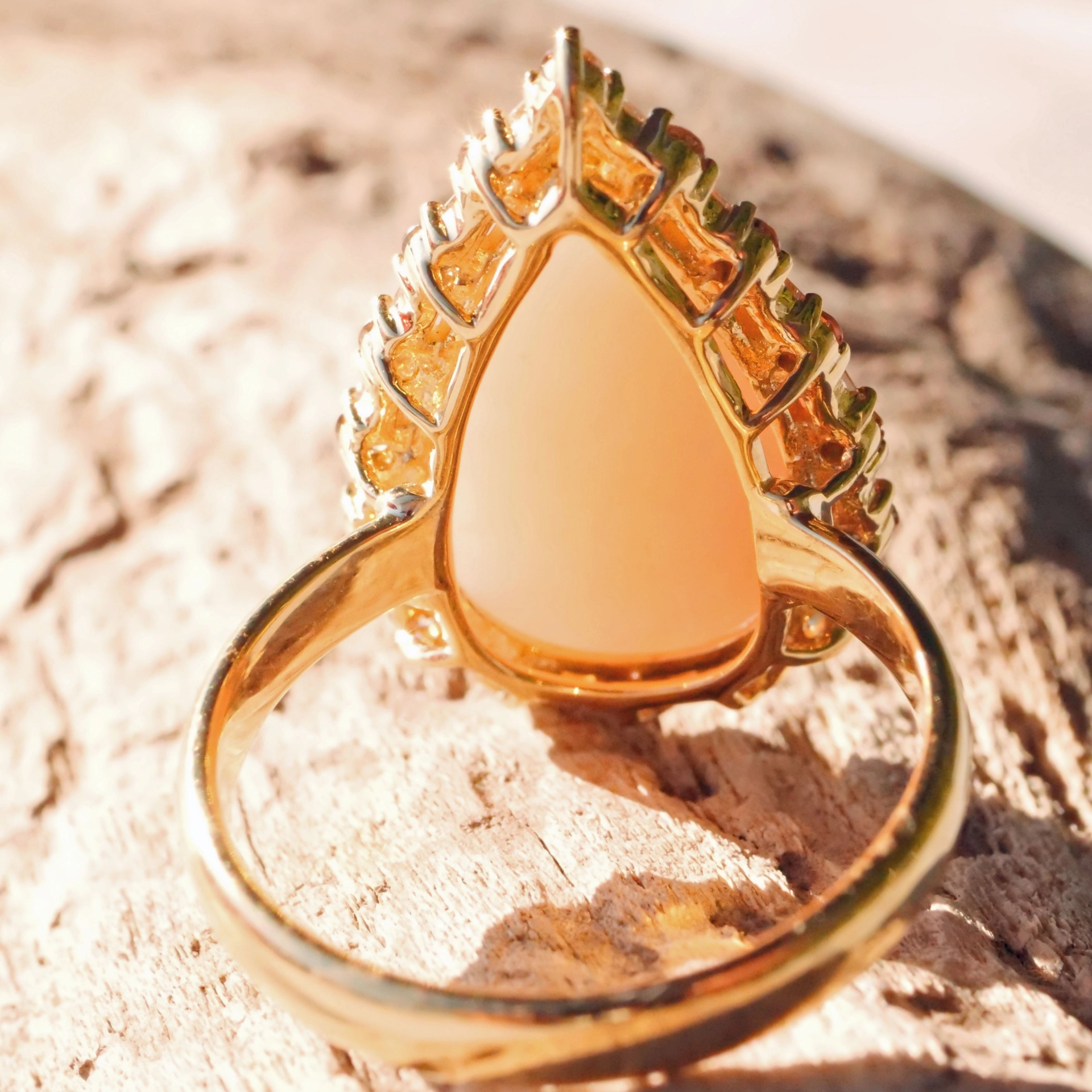 Andean Opal Cabochon effectively wreathed with Diamond Baguettes and Brilliants 18 kt Yellow Gold