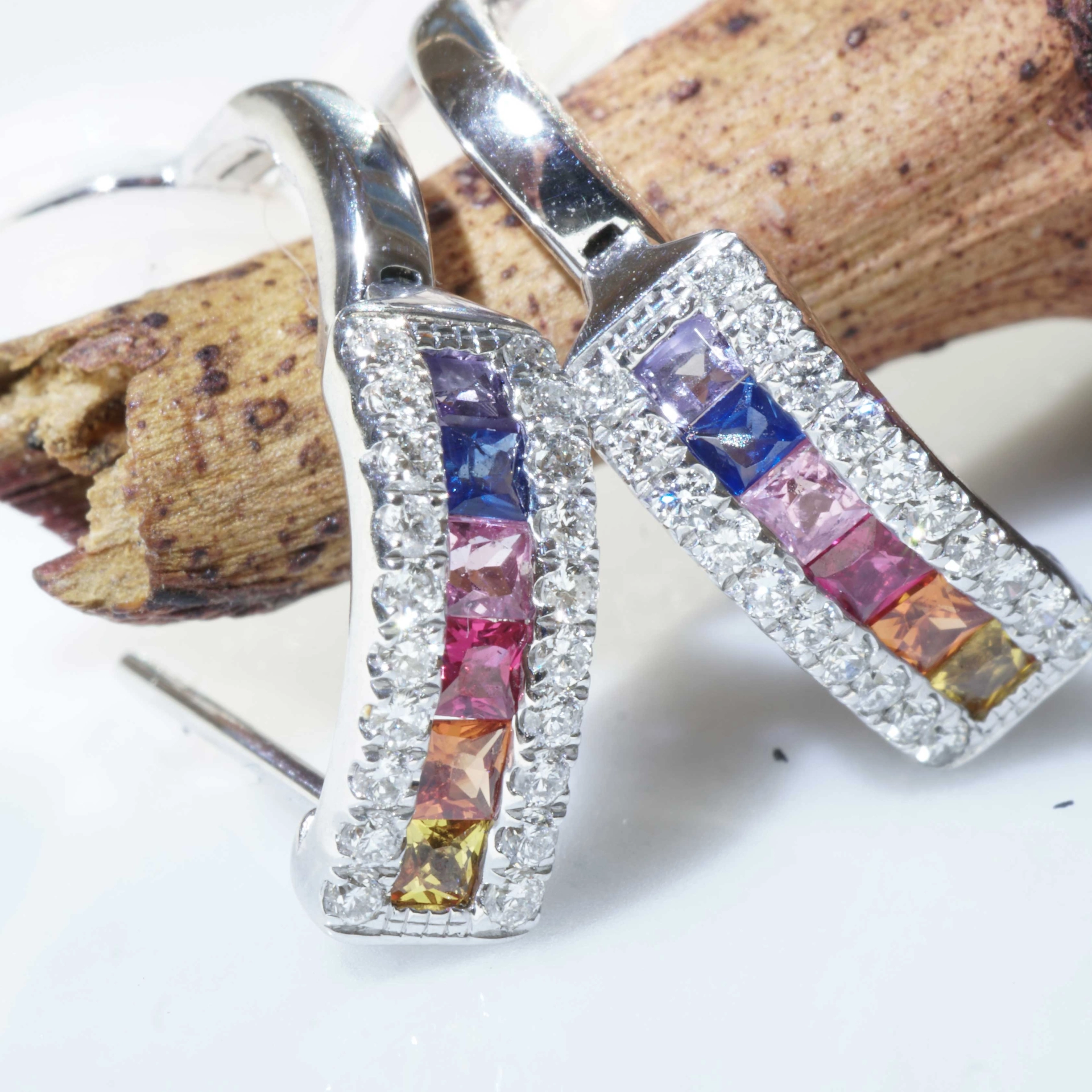 Half Creoles with Bar of colored Saphires, Rubies, Amethyst and Brilliants 18 kt White Gold