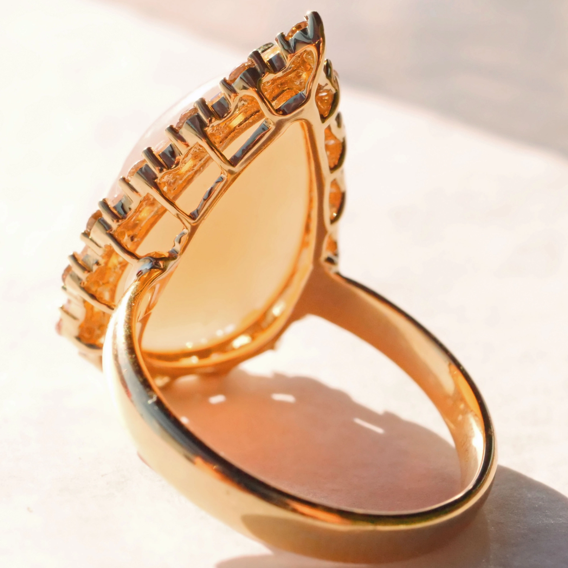 Andean Opal Cabochon effectively wreathed with Diamond Baguettes and Brilliants 18 kt Yellow Gold
