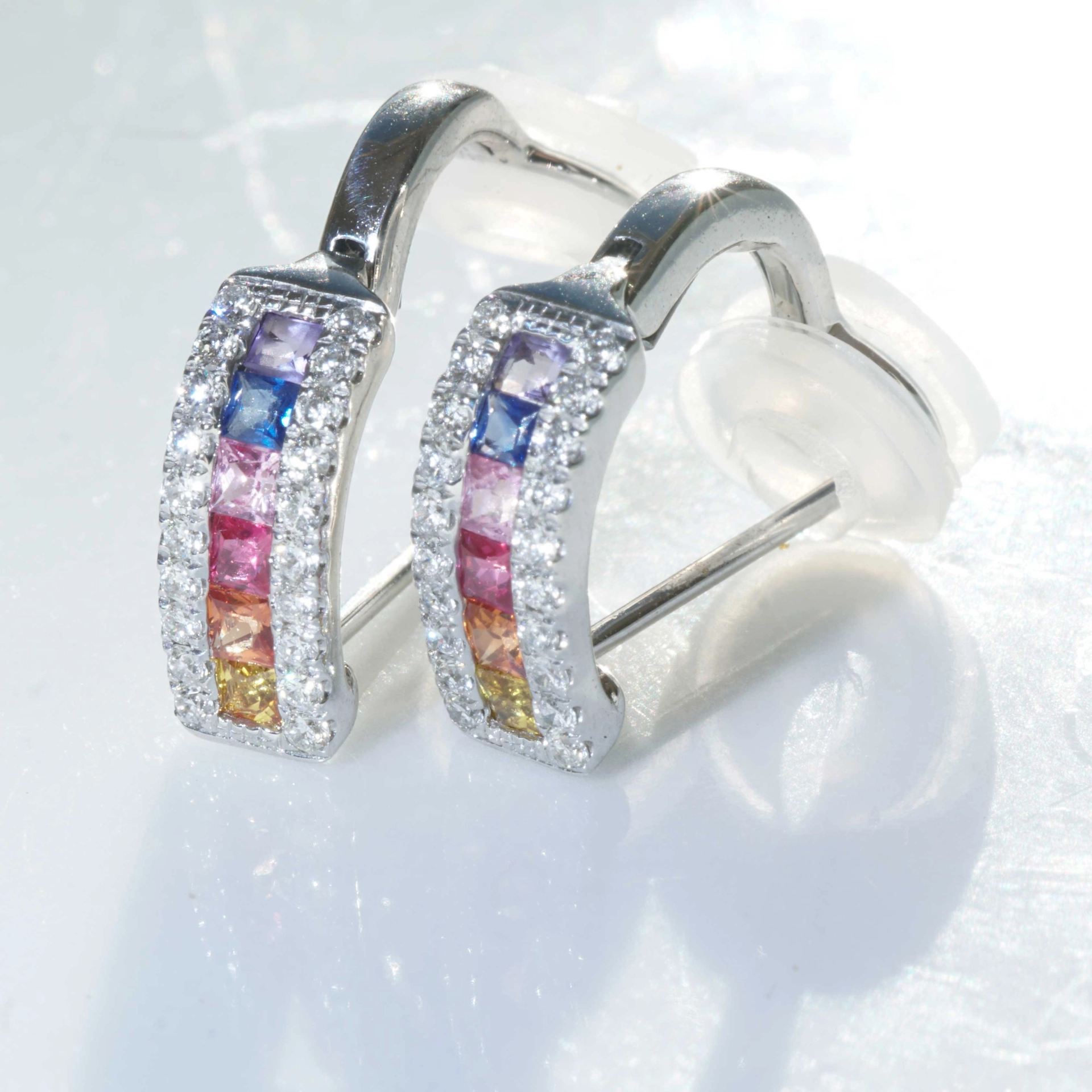 Half Creoles with Bar of colored Saphires, Rubies, Amethyst and Brilliants 18 kt White Gold