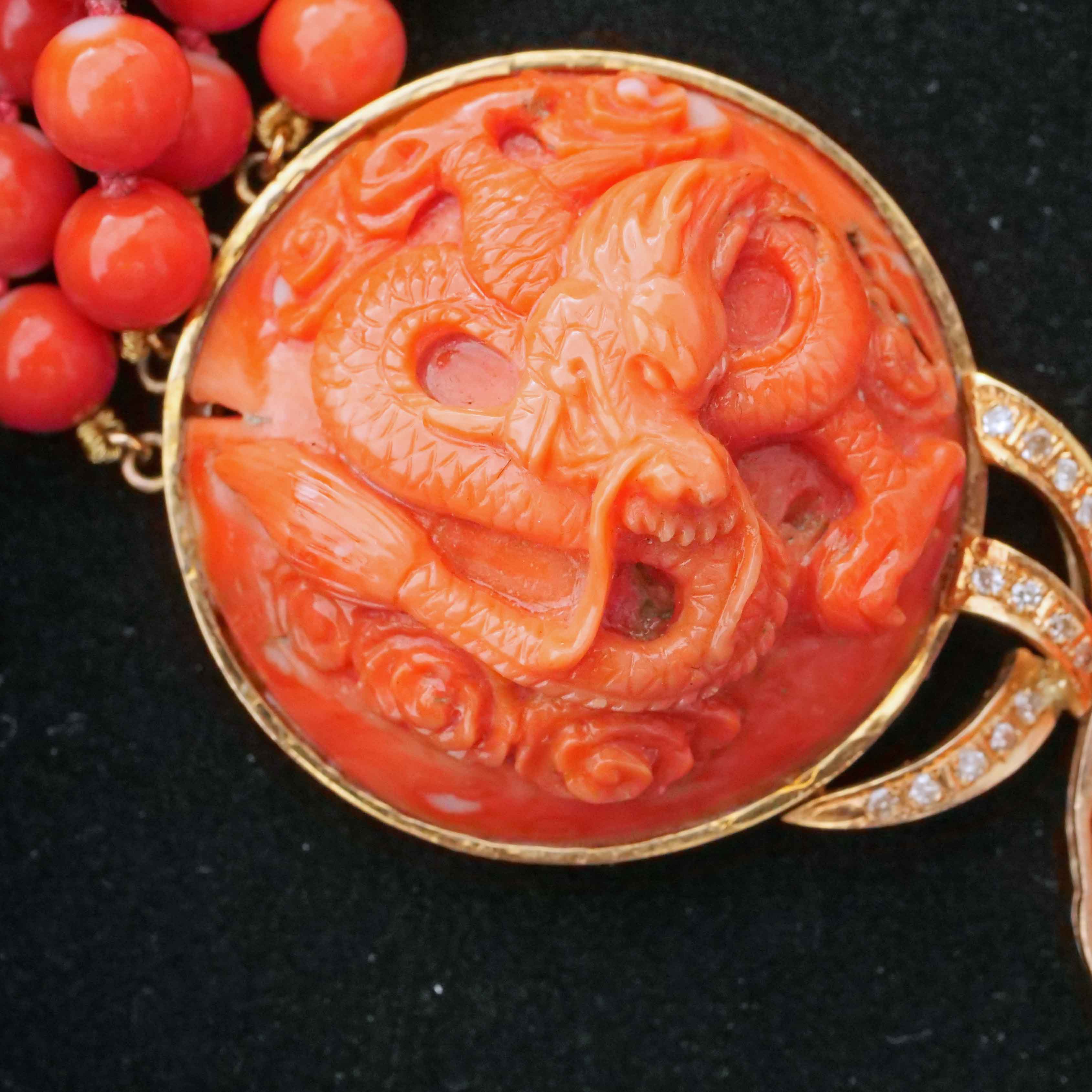 Coral Brilliant Necklace around 1980 with carved Dragon Motifs and four-row Coral Ball Chain
