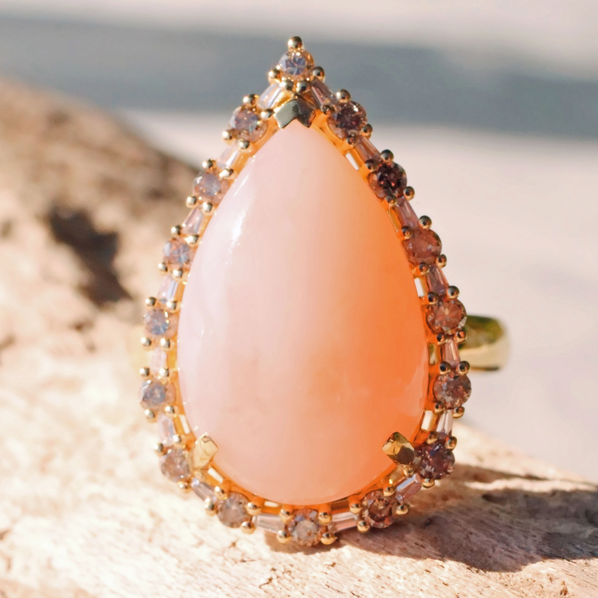 Andean Opal Cabochon effectively wreathed with Diamond Baguettes and Brilliants 18 kt Yellow Gold
