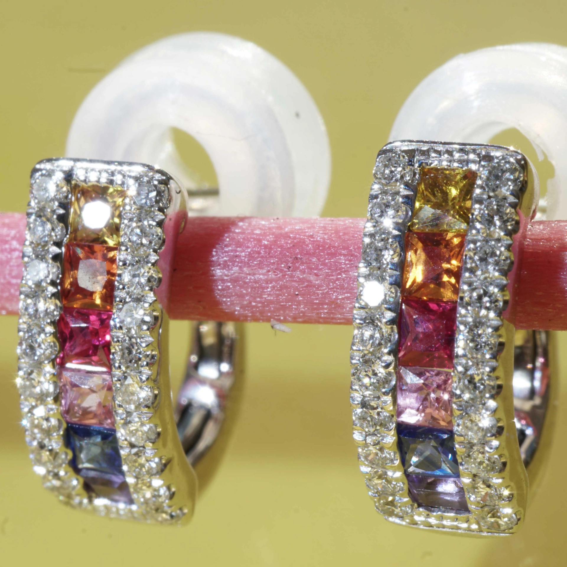 Half Creoles with Bar of colored Saphires, Rubies, Amethyst and Brilliants 18 kt White Gold